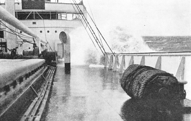 A HEAVY SEA coming aboard the foredeck of the Pennyworth