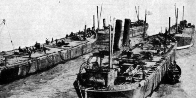 BETWEEN FOUR LIFTING VESSELS, the Brussels, raised 22 feet from her position in the mud