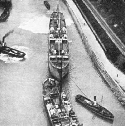 A COLLISION AVERTED by the skilful handling of ships and tugs