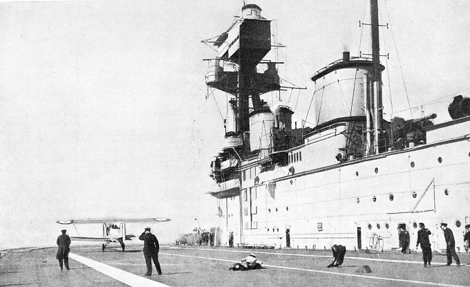 THE FLIGHT DECK OF H.M.S. EAGLE, showing the bridge and funnel